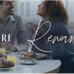 a man and woman sitting at a table with food